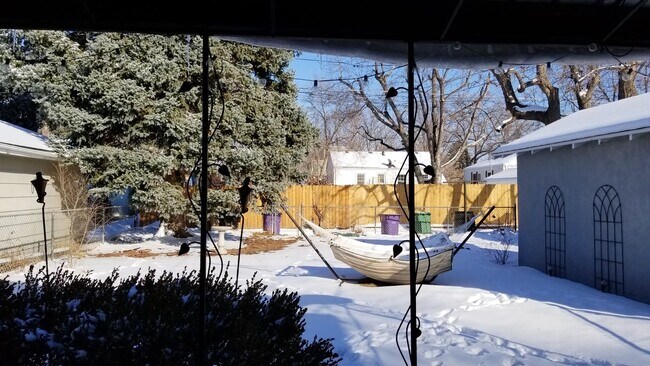 Enjoy outdoors in the covered patio or the large fenced yard! - 2278 S Emerson St