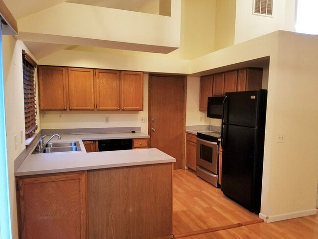 Building Photo - Spacious 4-Bedroom Home with Fenced Yard &...