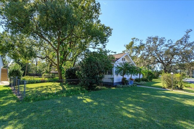 Photo - Run don't walk for this one of a kind beautifully maintained Old Florida Charmer on a park like d... House