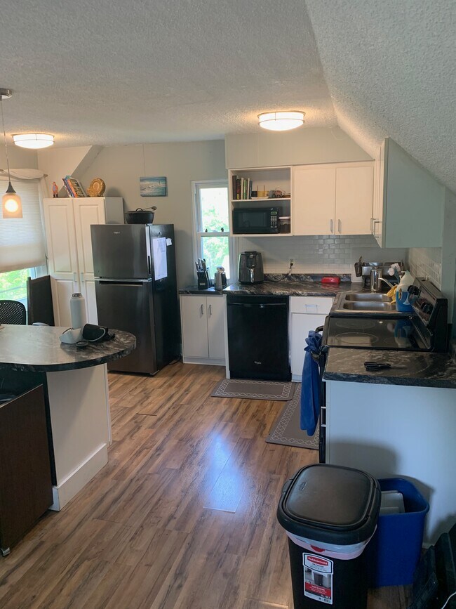 The kitchen and the island. - 207 S Cedar St