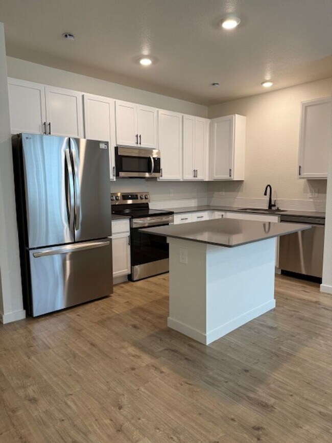 Building Photo - New 2 Bedroom Townhome + 2 Car Garage