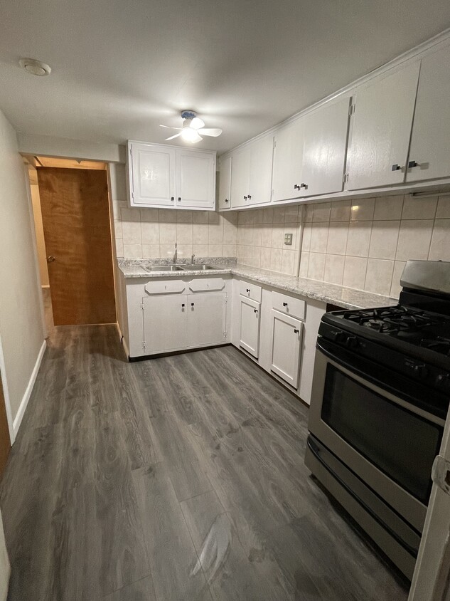 Kitchen with Wood Cabinets and Gas Stove - 3708 W Dickens Ave