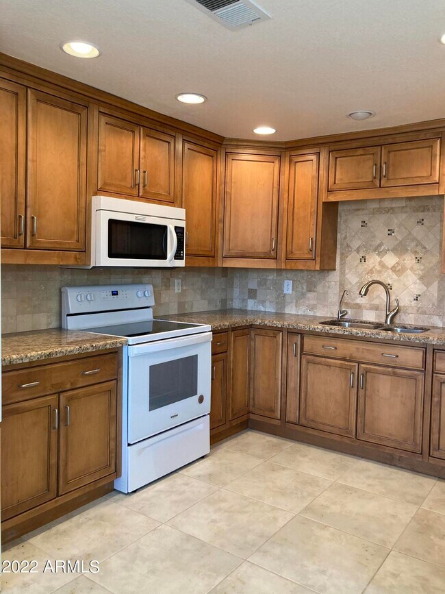Building Photo - 9455 E Raintree Dr