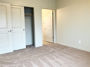 Claystone Dark Guest Bedroom - Stoneplace Apartment Homes