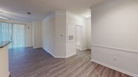 This contemporary apartment in Raleigh, NC offers 1130 square feet of thoughtfully designed living space. The single-story layout features three bedrooms, including a spacious 160 square foot primary bedroom, and two full bathrooms. The heart of the home is an open-concept kitchen and living area, showcasing light wood cabinetry, black appliances, and a convenient breakfast bar with granite countertops. Modern track lighting and crown molding add stylish touches throughout.

The apartment boasts updated flooring, with sleek wood-look laminate in the main living areas and plush carpeting in the bedrooms. Large windows in the bedrooms allow for ample natural light, while ceiling fans provide comfort and air circulation. The bathrooms feature wood vanities with granite countertops and shower/tub combinations.

For added convenience, the unit includes an in-unit laundry area with full-size washer and dryer. Three closets offer generous storage space. The neutral color palette and clean lines create a fresh, modern ambiance throughout the apartment, providing a blank canvas for personal style. Located at 10311 Arrow Creek Dr in Raleigh, this apartment combines contemporary design with practical amenities for comfortable urban living.