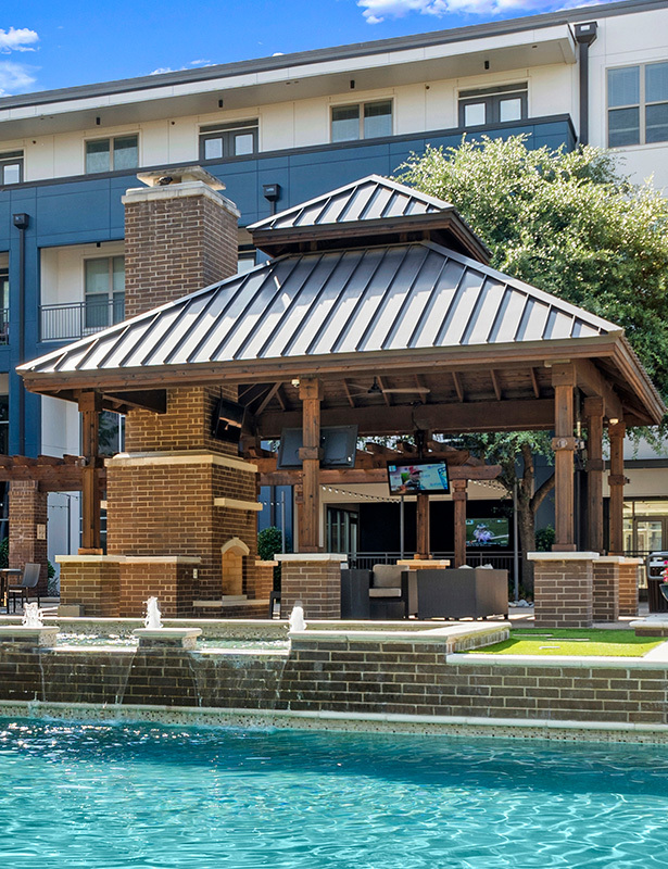 Cabana with tranquil water feature - Strata Apartments