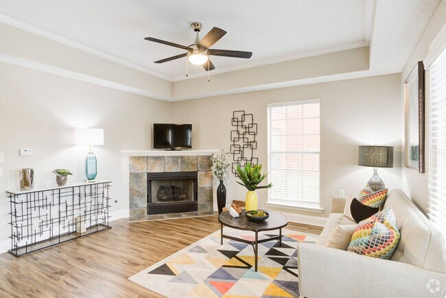 Living Room with Cozy Fireplace - Walnut Hill Apartments