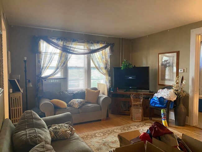 Living room; wood floors; will be repainted light cocoa - 1654 N Marshall St