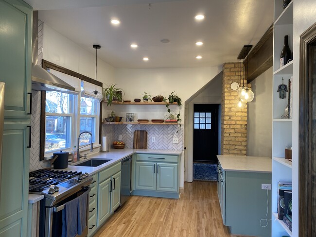 Open kitchen with island and all new appliances - 3224 38th Ave S