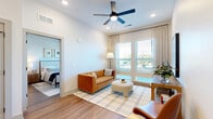 Located at 1201 Hillside Avenue in Nashville, TN, this well-appointed 2-bedroom, 2-bathroom residence offers a thoughtfully designed single-level layout. The open-concept living, dining, and kitchen area serves as the heart of the home, bathed in natural light from large windows dressed with elegant drapes and blinds. A ceiling fan adds comfort to the bright living space, which features warm hardwood flooring throughout.

The kitchen is a standout, boasting crisp white shaker cabinetry, a classic subway tile backsplash, stainless steel appliances including a gas range, and a generous quartz-topped island with bar seating illuminated by stylish pendant lighting. The seamless flow into the living and dining areas makes this an ideal space for entertaining.

The primary bedroom is a serene retreat with large windows, a ceiling fan, and direct access to a spacious walk-in closet with wire shelving. The en-suite bathroom features a glass-enclosed walk-in shower with floor-to-ceiling tile. The second bedroom is equally well-lit with generous closet access. The second bathroom includes a tub-shower combo, white vanity, and hardwood flooring. Additional conveniences include a dedicated laundry area and utility room, rounding out this polished Nashville residence.
