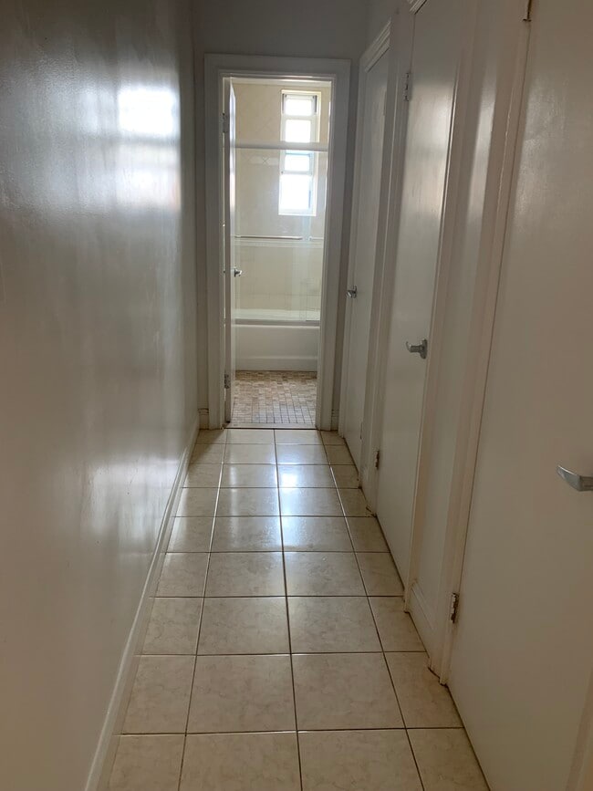 Tiled hallway with 3 closets - 286 Corbin Plz