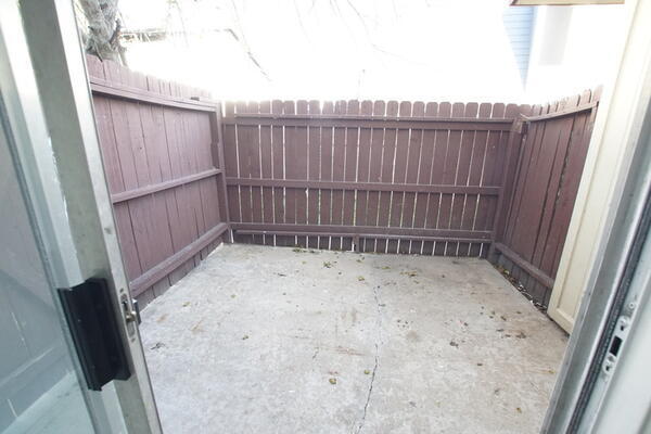 Side patio with washer dryer hookups in the side room - 1914 Hearthside Dr