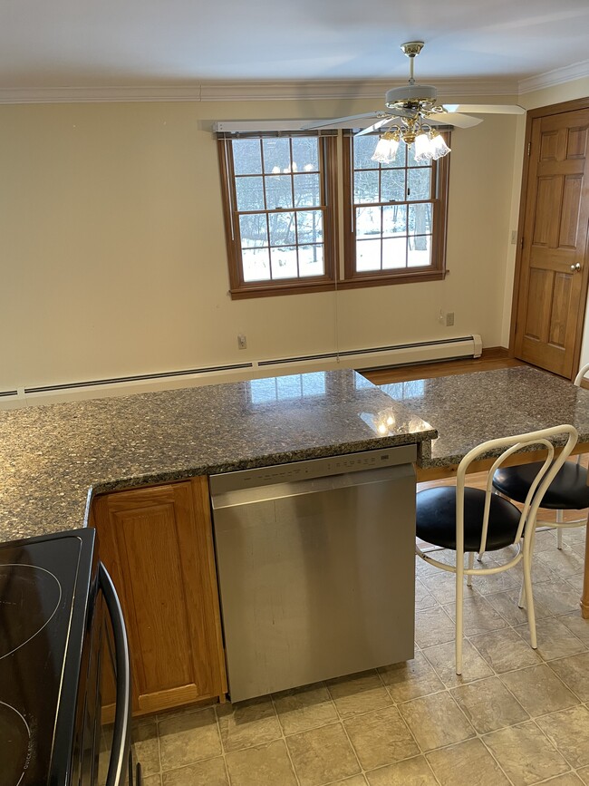 Kitchen open to eating area. Dishwasher included! - 123 Riverlin St