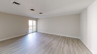 Located at 1194 Casa Brazilia Dr in Saint Louis, Missouri, this single-floor home offers four bedrooms and two full bathrooms thoughtfully arranged for comfortable living. Light wood-style luxury vinyl plank flooring runs consistently throughout, giving the space a clean, cohesive feel.

The combined kitchen and living area anchors the home, with the kitchen showcasing white shaker-style cabinetry, a classic subway tile backsplash, stainless steel appliances including a refrigerator and dishwasher, and a striking marble-look quartz island with a built-in gas cooktop. The open layout connects seamlessly to the living area, which features sliding glass doors that allow natural light to pour in and provide access to an outdoor space.

The four bedrooms are bright and well-proportioned, each featuring light neutral walls, the same wood-style flooring, and closets — including sliding-door and traditional hinged options. The primary bedroom offers a comfortable amount of space, while the additional bedrooms are well-suited for guests, a home office, or family use.

Both bathrooms are finished in a clean, all-white palette featuring tiled tub-shower combinations with chrome fixtures. A hallway connects the bedroom wing to the main living areas, keeping the layout functional and organized. The overall ambiance is fresh, modern, and move-in ready.