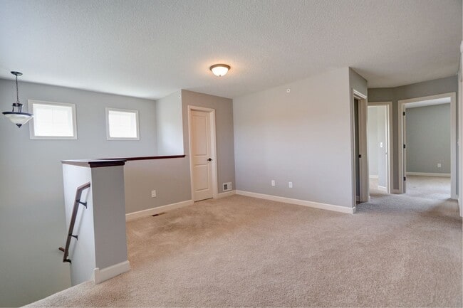 Building Photo - FANTASTIC END UNIT- NEW CARPET AND FRESH P...