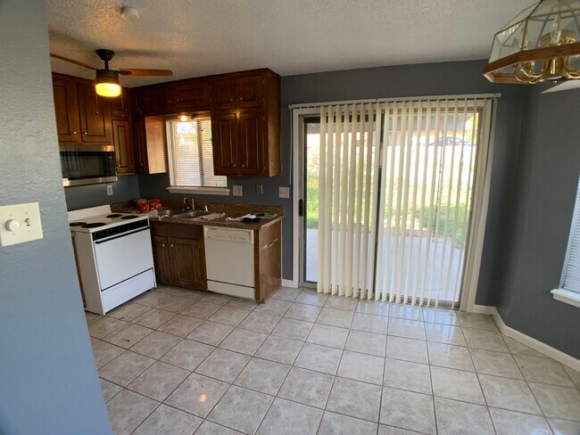 Kitchen looking towards backyard - 6400 Pizarro Dr