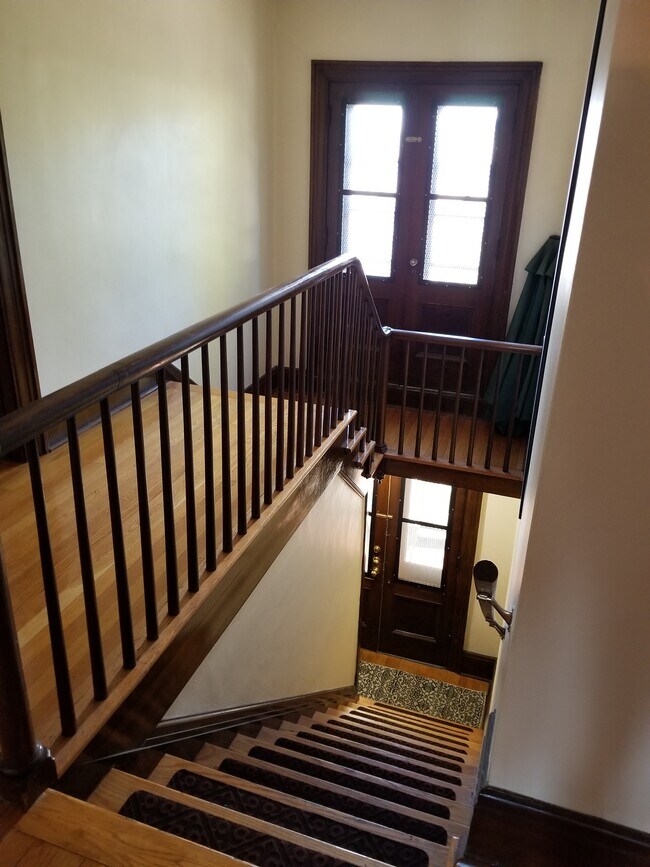 Upper apartment stairs. There is a foyer/mudroom at the bottom of stairs - 3404 Main St
