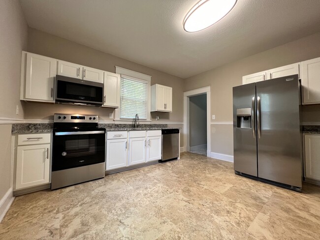 Updated kitchen with custom cabinets and new stainless steel appliances. - 2301 Liberty View Ln