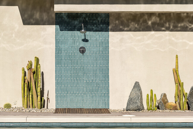 Stylish outdoor shower at a California desert rental. - 71535 Biskra Rd