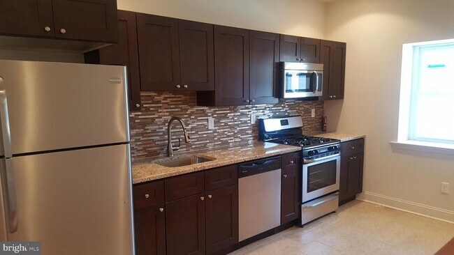 Foto del edificio - 5037 Florence Ave