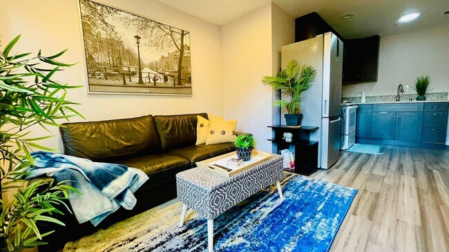 Living area with leather couch - 1051 Columbus Dr
