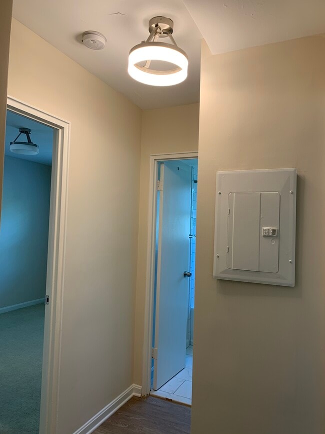 Hallway. Bedroom one is the door on the left and the Bathroom is the door on the right. - 526 Kenyon Street NW #101