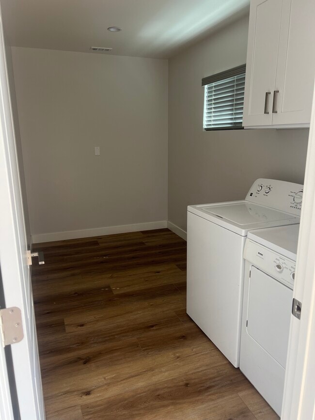 Laundry room/storage space to the right of the front door - 202 N Fairview St