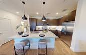 This contemporary residence in McKinney, Texas, offers 1,640 square feet of thoughtfully designed living space. The two-story layout comprises three bedrooms and three bathrooms, with the primary bedroom boasting a generous 260 square feet. The ground floor spans 620 square feet, while the upper level extends to 1,020 square feet.

The home's interior showcases a blend of functionality and style. The kitchen features sleek wood cabinetry, granite countertops, and stainless steel appliances, including a gas range and side-by-side refrigerator. A central island with seating adds convenience and casual dining space. The living area connects seamlessly to the kitchen, creating an open-concept design ideal for entertaining.

Bedrooms are well-proportioned, with plush carpeting and ceiling fans for comfort. Bathrooms feature modern fixtures, granite countertops, and wood-look flooring. The dedicated laundry room is equipped with full-size appliances and ample storage.

Throughout the home, large windows allow natural light to flood the spaces, while blinds offer privacy when needed. The neutral color palette and mix of carpet and wood-look flooring create a cohesive, contemporary ambiance. With its thoughtful design and desirable location on Pepperidge St in McKinney, this property offers a perfect blend of comfort and modern living.