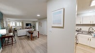 Located at 701 Cedar Ln in Knoxville, TN, this single-floor, 3-bedroom, 2-bathroom home offers a well-designed layout with a clean, modern aesthetic throughout. Light wood-style flooring runs continuously across the home, creating a cohesive and airy feel.

The living room is a welcoming space accented by a bold teal feature wall, natural light from large windows, and a sliding glass door that opens to an outdoor patio. The kitchen is efficiently designed with white shaker cabinetry featuring gold hardware, granite-style countertops, subway tile backsplash, and stainless steel appliances including a refrigerator and dishwasher. An electric cooktop island and in-unit washer/dryer add to the home's functionality. A skylight overhead brightens the space naturally.

The spacious primary bedroom impresses with vaulted ceilings, a vibrant teal accent wall, multiple windows for natural light, a ceiling fan, and a dedicated closet. The additional bedrooms are well-proportioned with ample closet storage. Both bathrooms are neatly finished, with one featuring a full tub/shower combination accented by tile surround. Throughout the home, neutral walls and light flooring create a bright, inviting atmosphere ideal for comfortable everyday living.