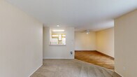 Located at 4900 SW Greensboro Way in Beaverton, Oregon, this single-floor, 2-bedroom, 3-bathroom home offers a practical and comfortable layout across a well-utilized footprint. The entrance welcomes you with wood-style flooring that flows into the living and dining areas. The living room is bright and open, featuring a ceiling fan and direct access to a private patio through a sliding glass door with vertical blinds, offering pleasant outdoor views. A pass-through window connects the living area to the kitchen, which includes wood-toned cabinetry and white appliances, keeping the layout social and connected. The dining area sits adjacent, completing a cohesive common living space. Both bedrooms are carpeted and filled with natural light from large windows dressed with vertical blinds, and each is served by baseboard heating. The primary bedroom offers a generous footprint with access to the hallway and closet. Three bathrooms, featuring tub-shower combinations with brushed nickel fixtures and wood-style flooring, provide ample convenience. Three closets offer plentiful storage throughout. A dedicated laundry room adds everyday practicality to complete this well-appointed Beaverton home.