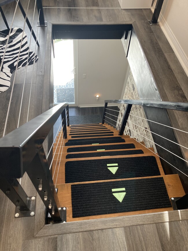 Modern stairs lead to your studio - 24734 Silver Stone Ct