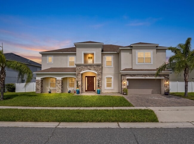 Photo - Spacious 6-Bedroom Home Near Lake Nona | 3-Car Garage + Tesla Charger