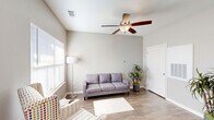 Located at 1925 Clearfork St in Lockhart, Texas, this single-story, two-bedroom, one-bathroom home offers a functional and comfortable layout. The open-concept living and kitchen area serves as the heart of the home, featuring warm wood-look hardwood flooring, neutral-toned walls, and a ceiling fan that enhances airflow throughout. Large windows allow natural light to fill the space, creating a bright and welcoming atmosphere.

The kitchen is well-equipped with dark espresso cabinetry extending to the ceiling for ample storage, white appliances including a refrigerator, range, built-in microwave, and dishwasher, along with a light-colored countertop and sink. A dedicated dining area adjacent to the kitchen provides space for everyday meals.

Both bedrooms are carpeted for comfort, each featuring a ceiling fan, a window with natural light, and easy closet access — with two closets included throughout the home. The bathroom is clean and practical, offering a single-sink vanity with dark cabinetry, a toilet, and a shower/tub combination with grab bars for added safety.

Additional highlights include a dedicated laundry room, a utility room, and a straightforward single-floor layout that promotes ease of living. The overall design is clean, modern, and move-in ready.