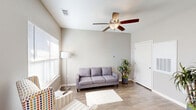Located at 1925 Clearfork St in Lockhart, Texas, this single-story, two-bedroom, one-bathroom home offers a functional and comfortable layout. The open-concept living and kitchen area serves as the heart of the home, featuring warm wood-look hardwood flooring, neutral-toned walls, and a ceiling fan that enhances airflow throughout. Large windows allow natural light to fill the space, creating a bright and welcoming atmosphere.

The kitchen is well-equipped with dark espresso cabinetry extending to the ceiling for ample storage, white appliances including a refrigerator, range, built-in microwave, and dishwasher, along with a light-colored countertop and sink. A dedicated dining area adjacent to the kitchen provides space for everyday meals.

Both bedrooms are carpeted for comfort, each featuring a ceiling fan, a window with natural light, and easy closet access — with two closets included throughout the home. The bathroom is clean and practical, offering a single-sink vanity with dark cabinetry, a toilet, and a shower/tub combination with grab bars for added safety.

Additional highlights include a dedicated laundry room, a utility room, and a straightforward single-floor layout that promotes ease of living. The overall design is clean, modern, and move-in ready.