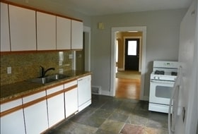 Building Photo - 3 BD. 1 BA. Granite Counters. Wood Floors
