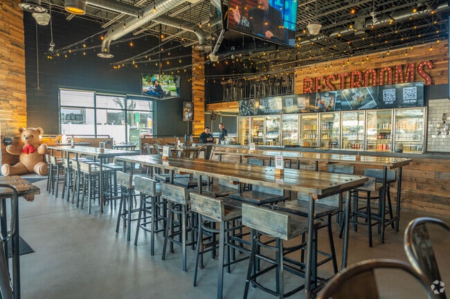 The bar at Plank Pizza Beer Parlor offers a lively social hub.