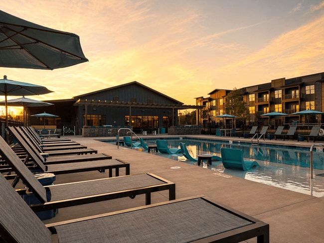 Resort-style pool featuring a baja shelf and expansive sundeck for lounging. - Cypress Point