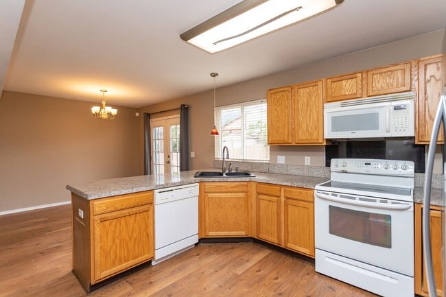 Building Photo - Exceptional 4-Bedroom Home with Cozy Firep...
