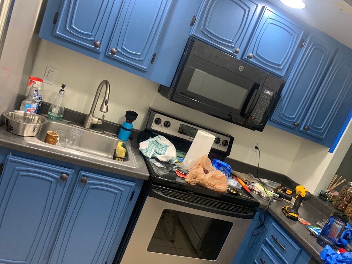 This is the kitchen that has just been repainted and will be cleaned up for showings. - 603 SW 75th St