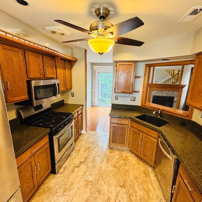 Building Photo - Spacious 3-Bedroom, 3-Bathroom Townhome with Finished Basement, Garage & Fenced Yard