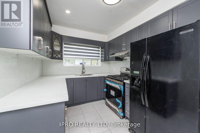 Photo du bâtiment - 7150 Minotola Ave