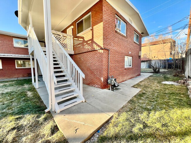 Explore this inviting brick apartment with its charming outdoor staircase, perfect for easy access and style. - 1301 Ammons Street