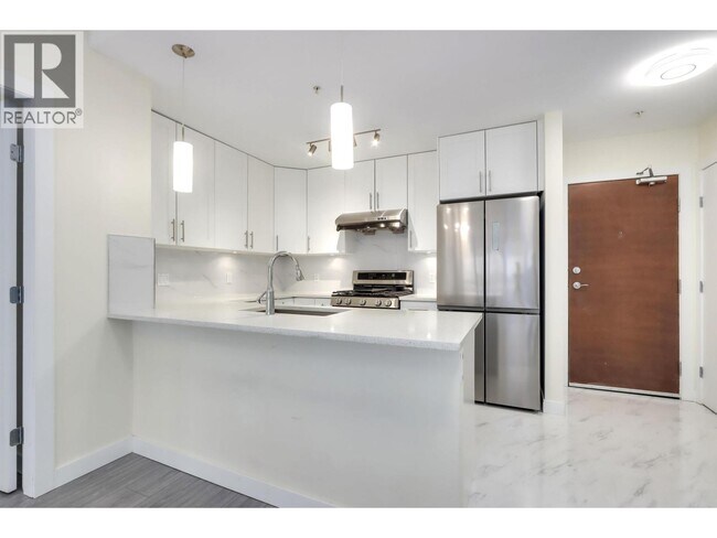 Photo du bâtiment - 6888 Alderbridge Wy