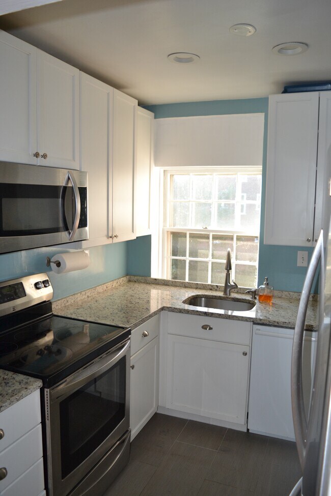 Updated kitchen with extra cabinet storage. - 3824 Porter St NW