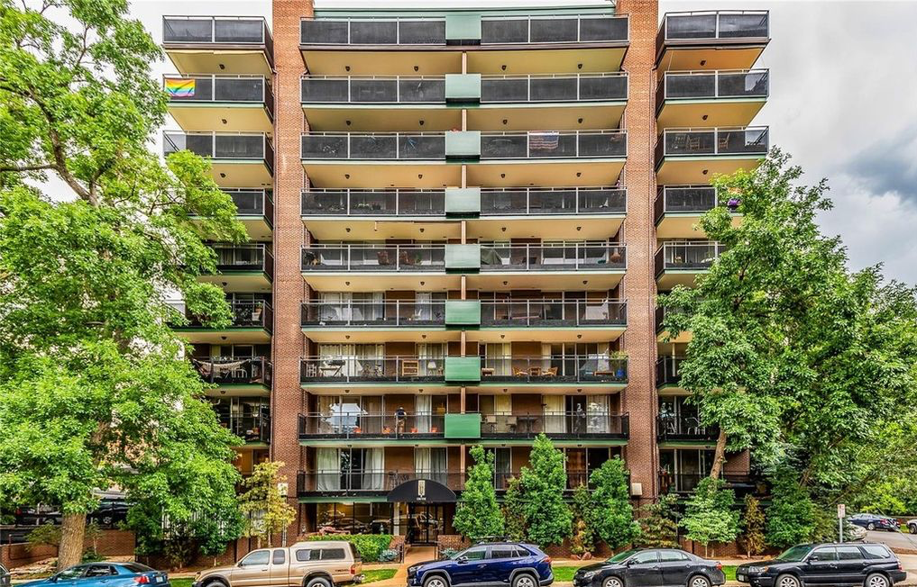 Exterior view of the condominium, featuring a classic brick building with spacious balconies - 1200 Vine St