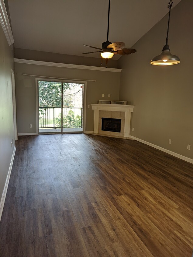 Open concept living with upgraded paint, flooring and fireplace! - 76 Al Henderson Blvd