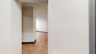 Located at 11325 Park Vista Blvd in Fort Worth, TX, this well-appointed one-bedroom, one-bathroom residence offers a thoughtfully designed single-floor layout with a clean, modern aesthetic. Light-toned wood-style flooring flows throughout the main living areas, complemented by crisp white walls, dark baseboards, and recessed lighting that create a bright, cohesive feel.

The open-concept kitchen and living area serves as the heart of the home. The kitchen features white shaker-style cabinetry extending to the ceiling, granite countertops, a large center island with bar seating, a gooseneck faucet, and a full suite of stainless steel appliances including a refrigerator with ice maker, a range, and a microwave. Elegant pendant lights hang above the island, adding a touch of contemporary style.

The bedroom is a comfortable retreat with plush carpeting, natural light from blinded windows, a ceiling fan, and ample wall space. A connecting area leads to additional room, offering layout flexibility.

The bathroom is finished with light wood-style flooring, white cabinetry, granite countertops, a rectangular undermount sink, a large mirror, and a full tub-shower combo with classic white subway tile surround. A hallway connects the key areas of the home, ensuring a functional and efficient flow throughout.
