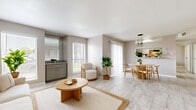 Located at 15570 Bellaire Blvd in Houston, TX, this single-floor, 2-bedroom, 2-bathroom unit offers a clean and functional layout designed for comfortable everyday living. The open-concept living and dining area is anchored by light marble-look tile flooring that runs throughout the space, creating a cohesive and airy feel. Large windows and a sliding glass door in the dining area flood the space with natural light, complemented by stylish industrial-style pendant lighting above the dining area. A pass-through window connects the dining area to the kitchen, which features gray cabinetry and granite-style countertops. The living room offers ample space with neutral warm-toned walls. Both bedrooms are well-sized, each equipped with ceiling fans, closets, and the same light tile flooring for a consistent aesthetic. The primary bedroom includes two closets for generous storage. Both bathrooms feature floor-to-ceiling marble-look tile surrounding a soaking tub and shower combination, with coordinating tile flooring. Three closets are distributed throughout the unit, providing practical storage solutions. The overall ambiance is light, neutral, and modern, making this a well-rounded and inviting space.