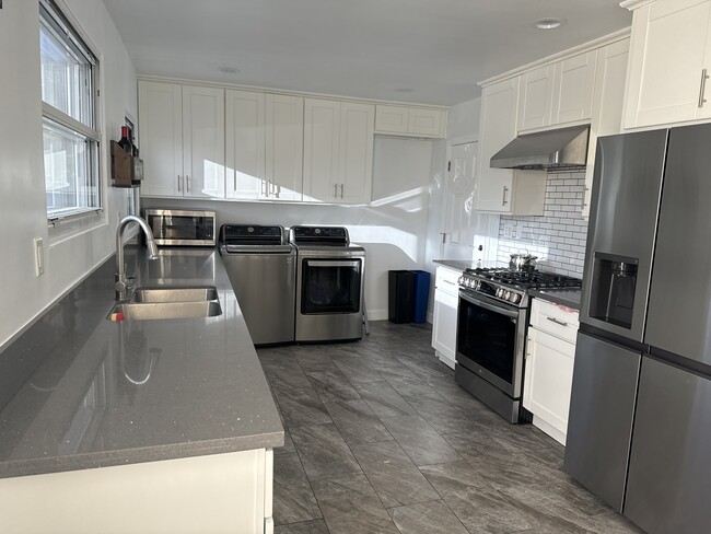 Kitchen and laundry room - 10215 S Gramercy Pl