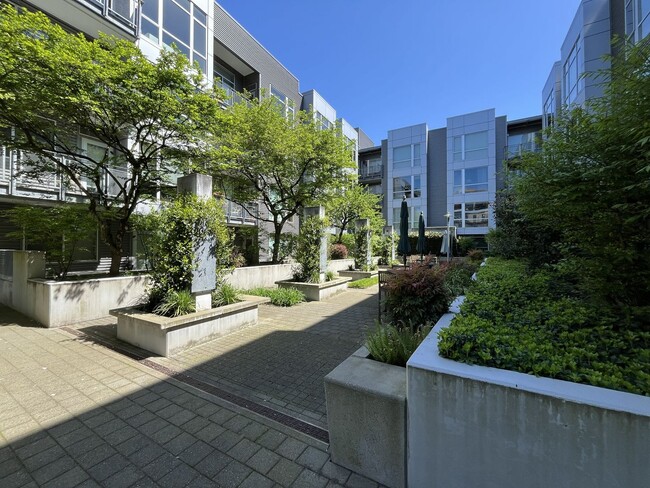 Photo - Top-Floor Pearl District Condo with Floor-to-Ceiling Windows, Courtyard Views & In-Unit Washer/Dryer